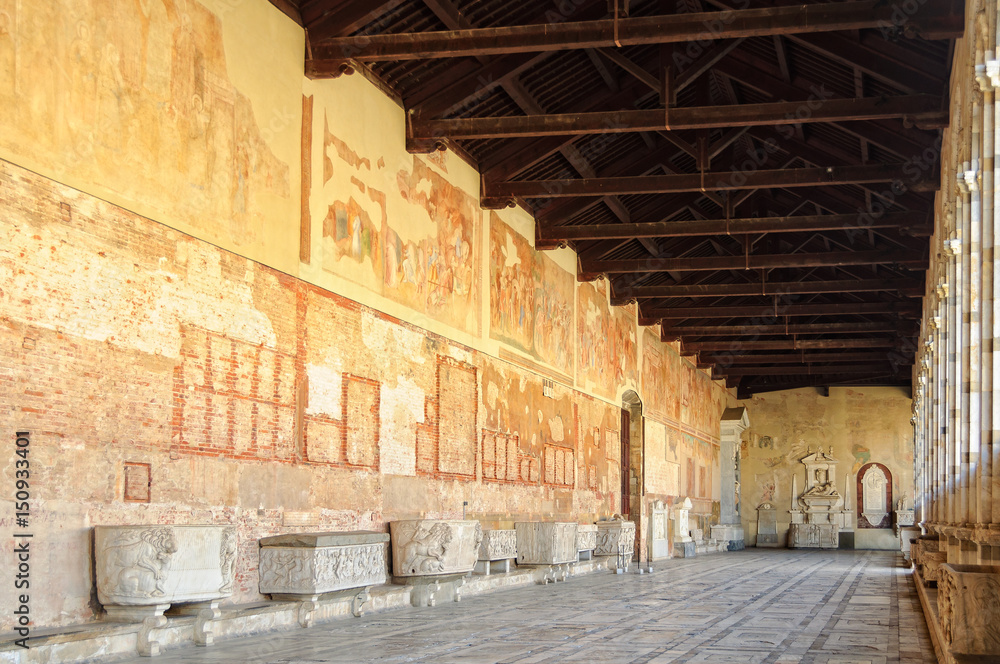 Fototapeta premium Frescoes and sarcophagi in the hallway of the Cemetery (Camposanto) on the Square of Miracles (Campo dei Miracoli) in Pisa, Tuscany, Italy