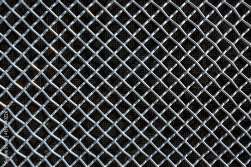 metal mesh or aluminum grid on black background