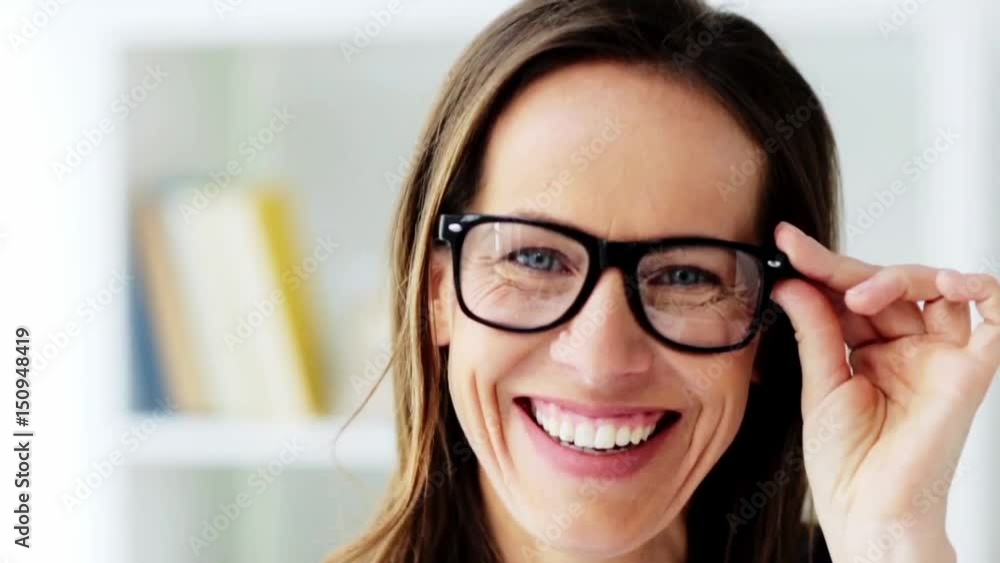 face of happy smiling middle aged woman in glasses face of happy smiling middle aged woman in glasses