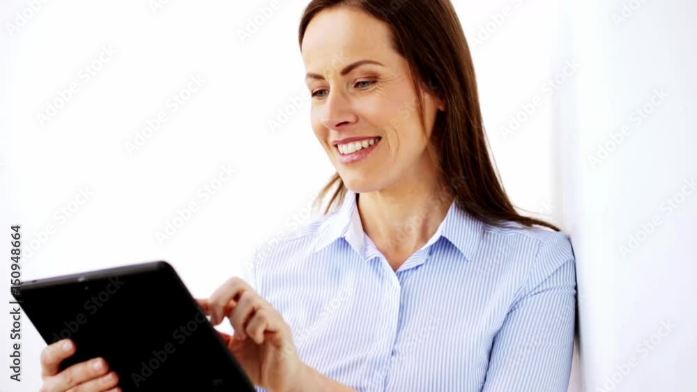 smiling businesswoman with tablet pc computer smiling businesswoman with tablet pc computer