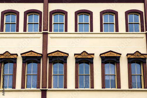 Ornate Windows on Yellow Plaster Building © dbvirago