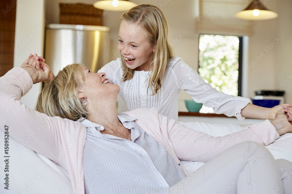 Little girl having fun with her grandmother at home Little girl having fun with her grandmother at home