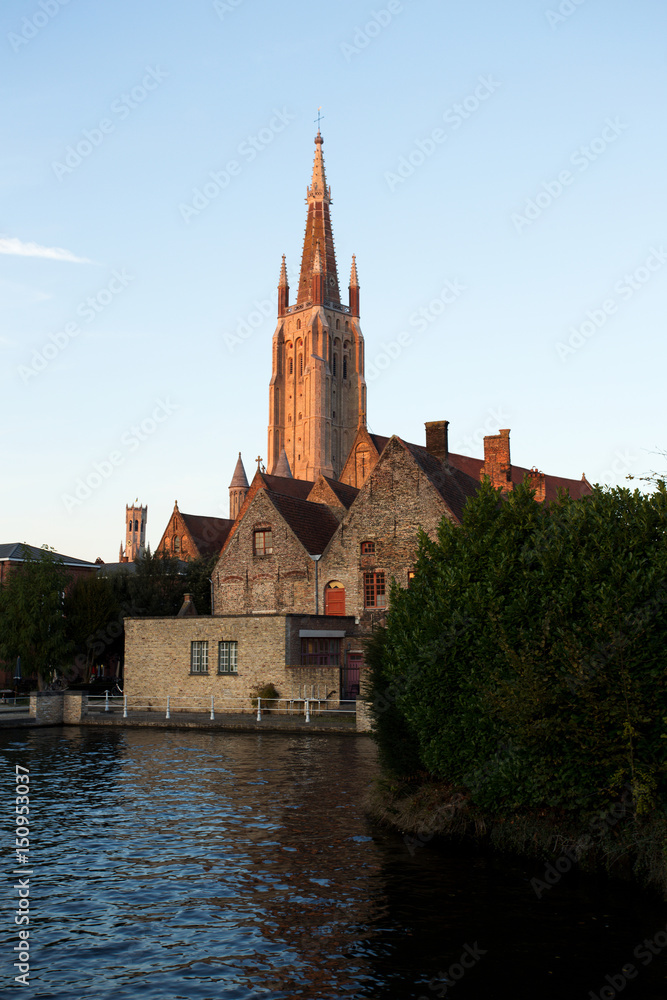 Naklejka premium Historic Medieval City of Bruges with River Canal at Sunset, Belgium