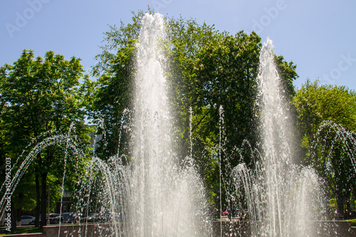 Splashes of fountain water in city park