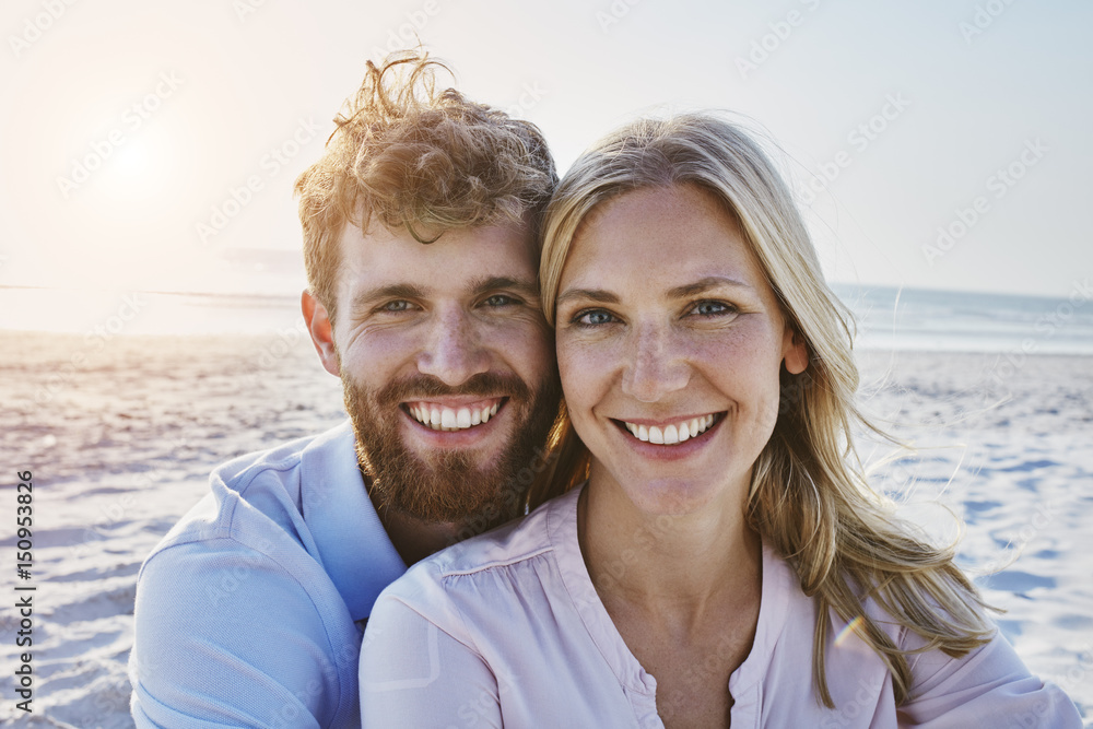 Portrait of happy couple on the beach Portrait of happy couple on the beach