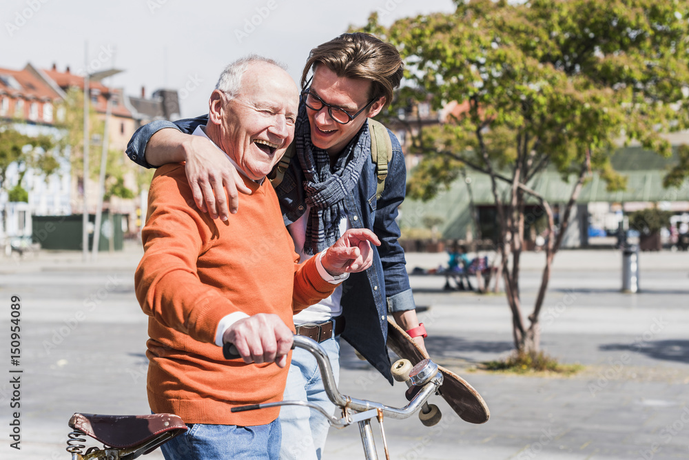 custom made wallpaper toronto digitalHappy senior man with adult grandson in the city on the move