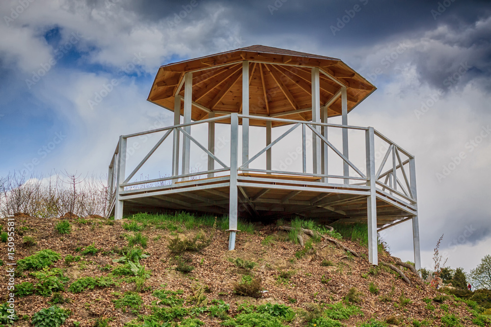 White Wooden garden house, alcove in the park. View bottom White Wooden garden house, alcove in the park. View bottom