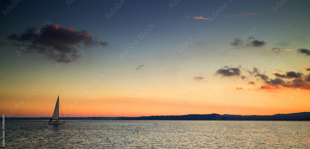 sailing boat at the sunset