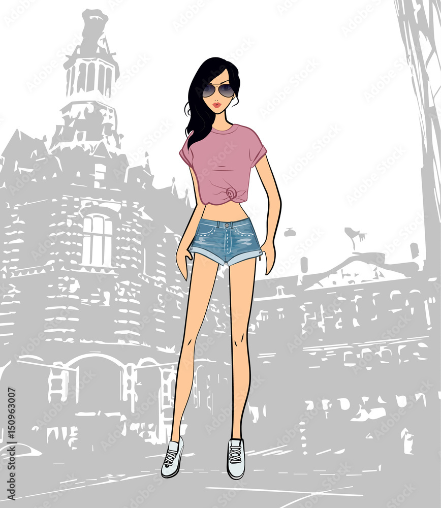 Fashionable cute brunette girl in a purple top and shorts in the city Fashionable cute brunette girl in a purple top and shorts in the city