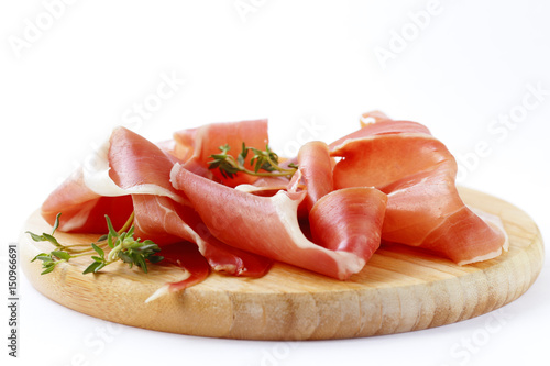  Smoked Parma ham on a wooden board