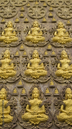 Wallpaper of buddha on temple wall, Bangkok Thailand © Gobchayatorn