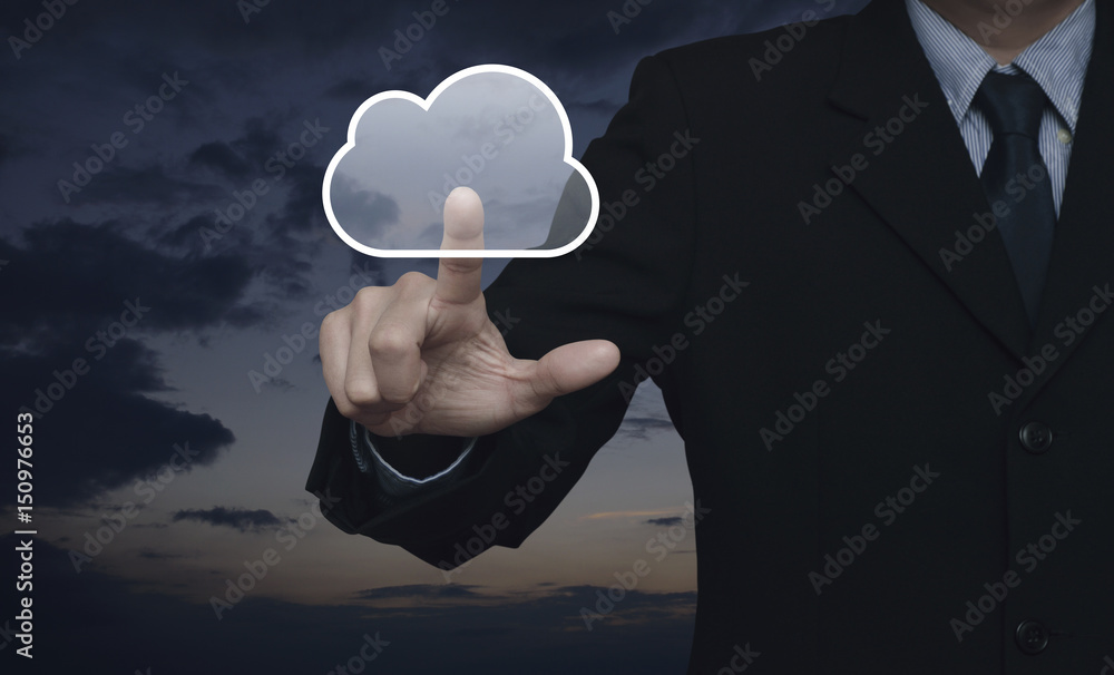 Businessman pressing cloud button over sunset sky, Internet concept