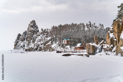 View of snow mountain and a village in Frozen Lake Baikal