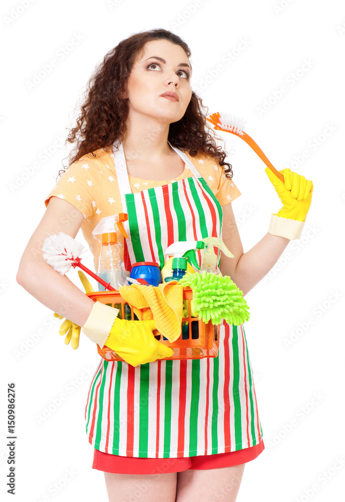 Tired young housewife with yellow gloves and cleaning supplies, isolated on white background