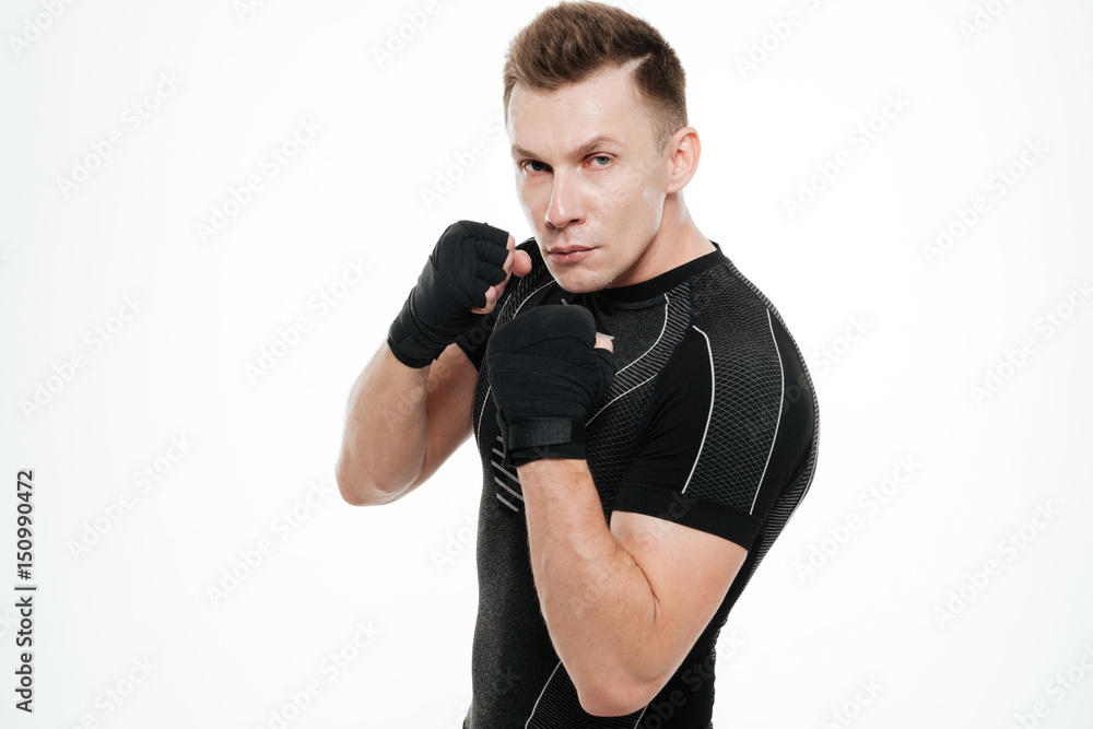 Sportsman boxer standing isolated over white background