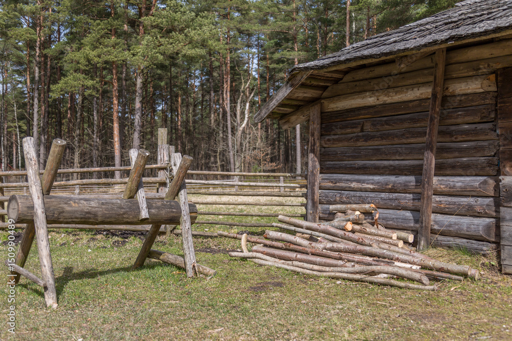 Otside The Old Wooden House in Estonian Village in spring 