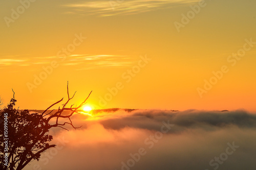 sun over mountain mist in sunrise,mist on sunrise,mist over mountain during sunrise