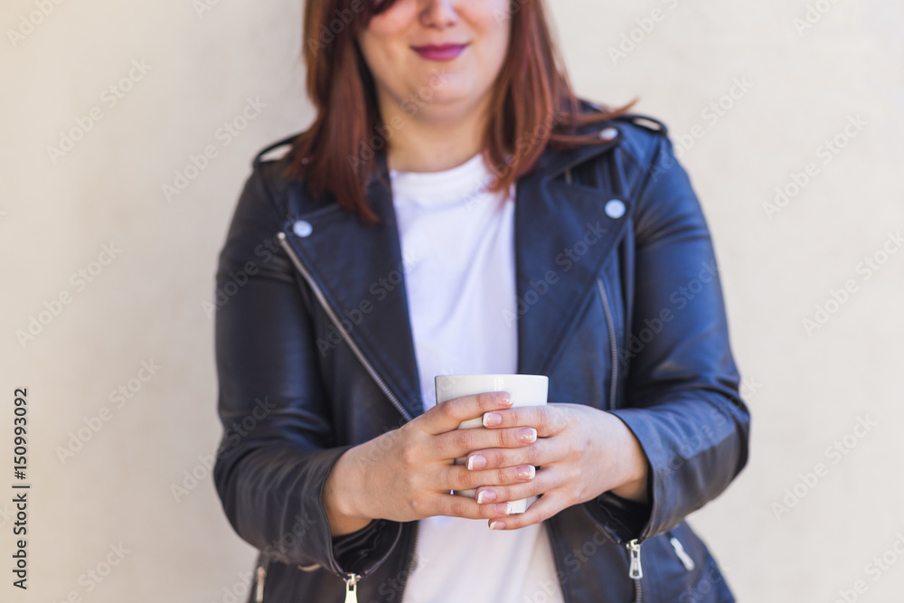 close up of woman hands holding a cup of coffee. sunny weather. white background. outdoors. Lifestyle. close up of woman hands holding a cup of coffee. sunny weather. white background. outdoors. Lifestyle.
