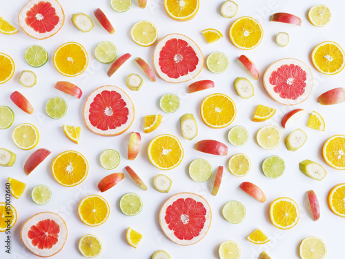 Fototapeta Naklejka Na Ścianę i Meble -  Fruit pattern. Food background. Fresh citrus fruits in a cut.