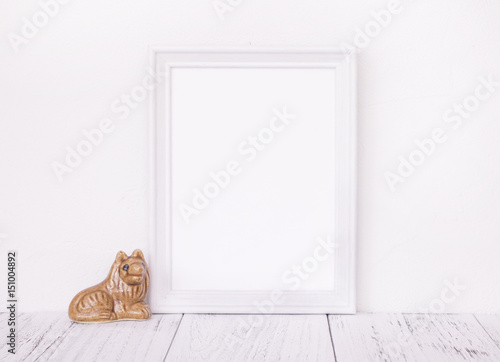 Stock photography of retro white frame template vintage wood table and cute ceramic doll