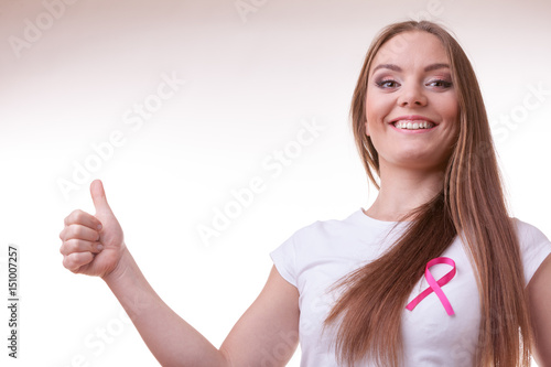 Wallpaper Mural woman pink cancer ribbon on chest making thumb up Torontodigital.ca