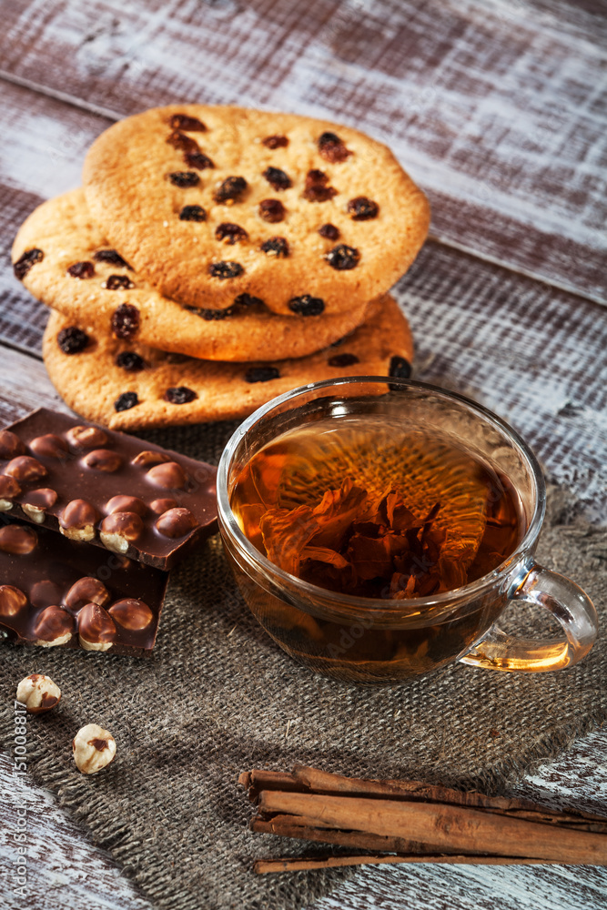 cookie chocolate and tea on a wooden table cookie chocolate and tea on a wooden table