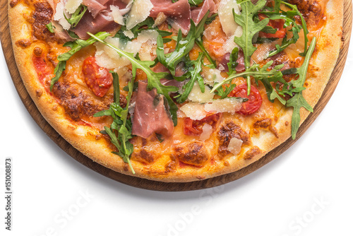 pizza with prosciutto and arugula isolated