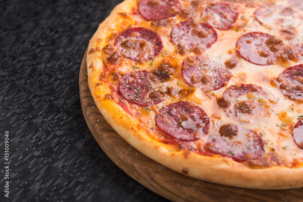 Closeup of hot pizza with salami sausage Closeup of hot pizza with salami sausage