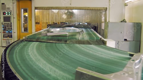 transporting tape with moving details of car body in automobile factory, making car body