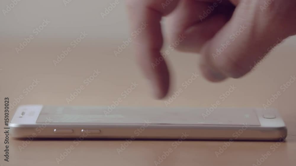 Male fingers manipulating an electronic map on a smart phone Male fingers manipulating an electronic map on a smart phone