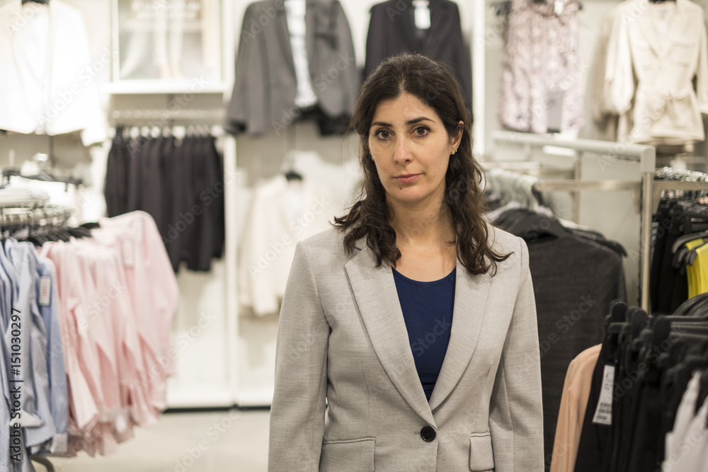 Woman buying clotes in mall Woman buying clotes in mall
