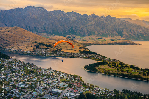 Paragliding over Queenstown and Lake Wakaitipu from viewpoint at Queenstown Skyline, New Zealand photo