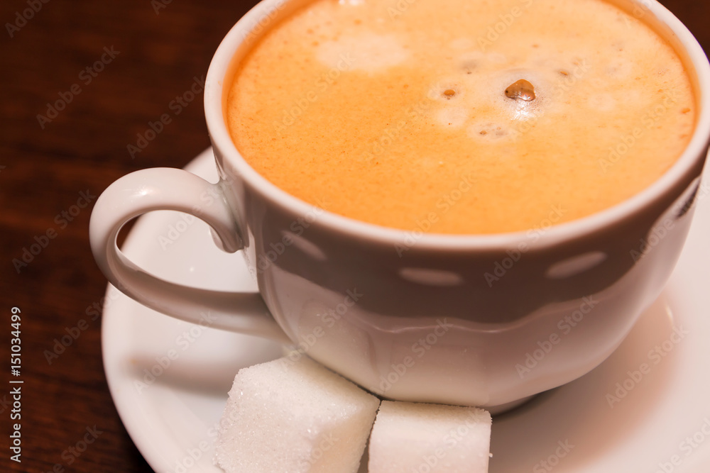 A cup of coffee with sugar A cup of coffee with sugar