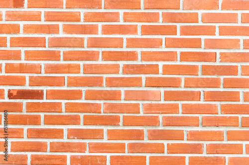 Red brick wall with one special darker brick background