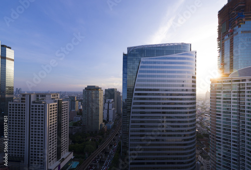 Office building in business district with sunshine. © newroadboy