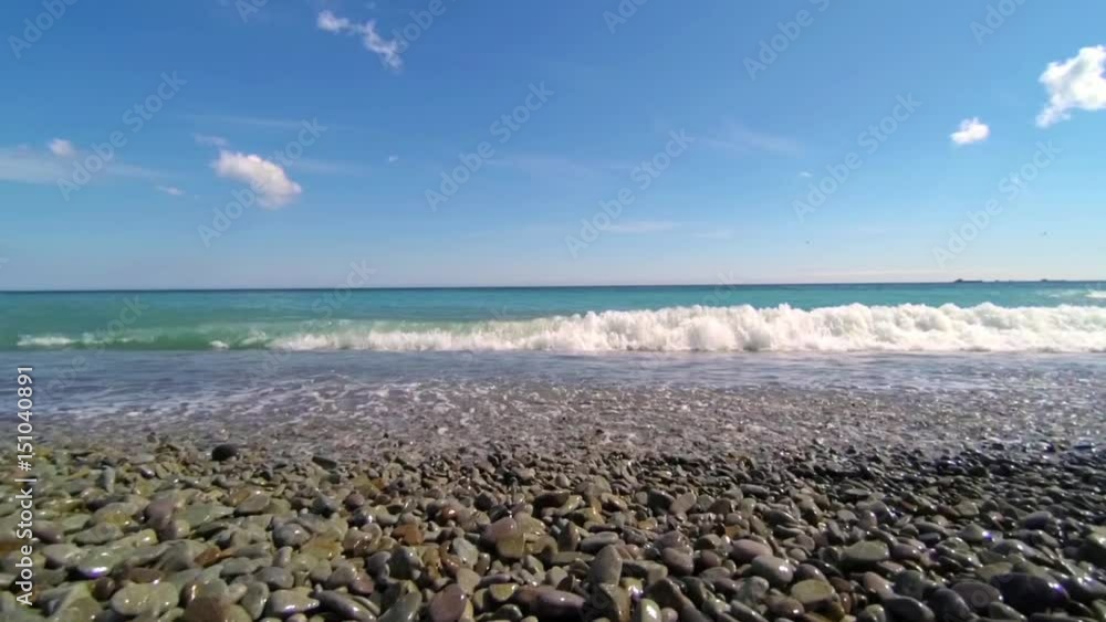 Slow motion video of waves on the pebble beach in black sea Slow motion video of waves on the pebble beach in black sea