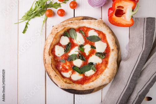 Fotografia Pizza on wooden board