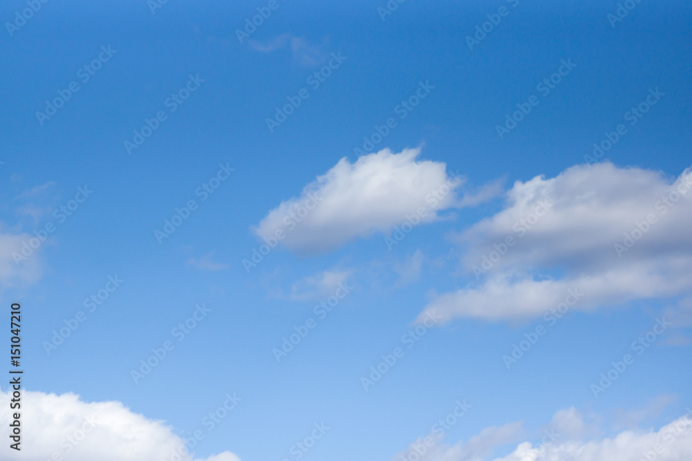 White clouds against a blue sky White clouds against a blue sky