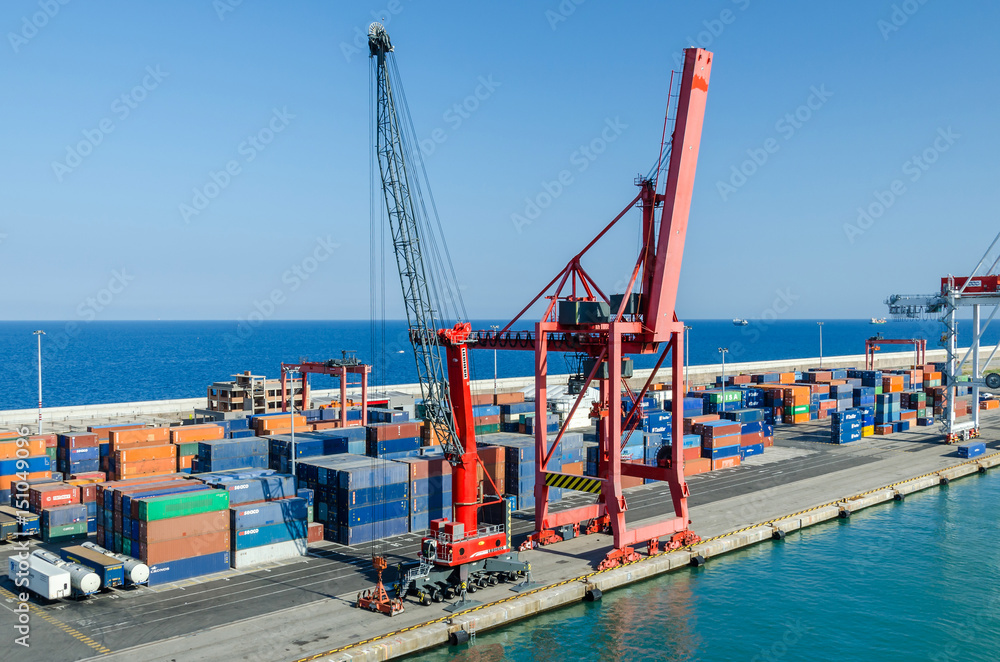 View of commercial port with rail cranes in Barcelona, Spain