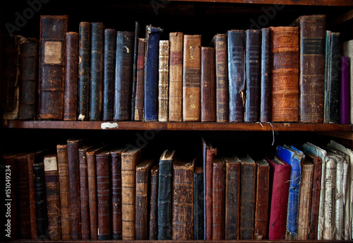 Antique books on bookshelf