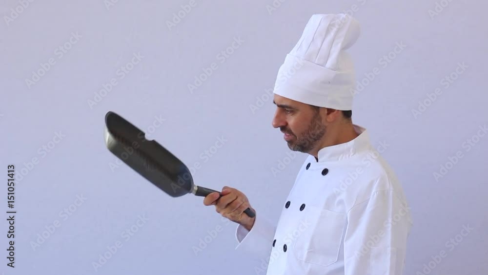 Extremely funny cook in the kitchen wearing chef uniform