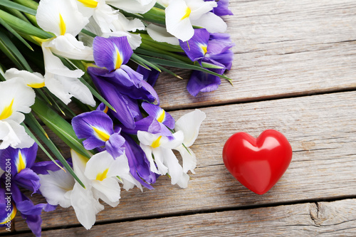 Fototapeta Naklejka Na Ścianę i Meble -  Bouquet of iris flowers on grey wooden table