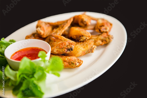 Fried chicken wings on white dish, Thai food