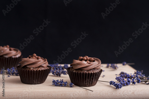 Chocolate Cupcakes on a wooden chopping board and lavender flowers