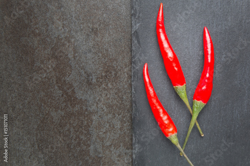 Red chili pepper on a stone background