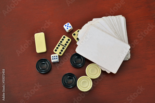 Various board games chess board, playing cards, dominoes. Hobby. Metaphor for games and gambling. photo