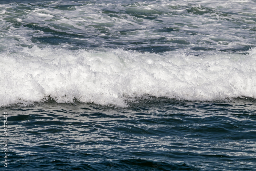 Close up Ocean Waves Breaking on Coastal Shoreline Close up Ocean Waves Breaking on Coastal Shoreline