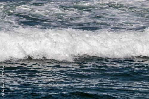 Close up Ocean Waves Breaking on Coastal Shoreline © lcswart