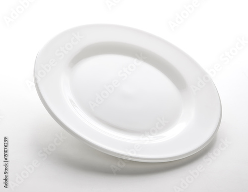 White plate isolated on white table, empty dish template