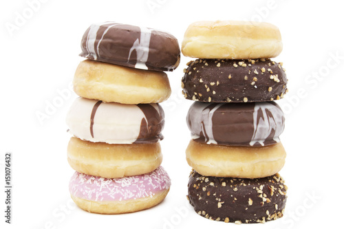 donuts stacked varied on white background